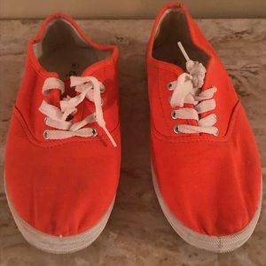 Bright orange sneakers